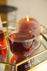 Glass cup of tasty tea on table in cafe