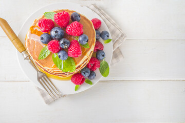 Pancakes stack with fresh berries
