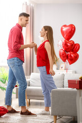 Happy couple dancing at home. Valentine's Day celebration