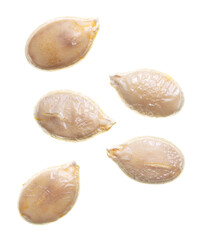 Close-up of pumpkin seeds on a white background.
