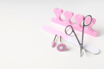 Concept of nail care with manicure accessories on white background