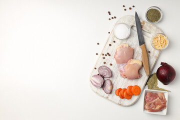 Concept of cooking chicken soup on white background