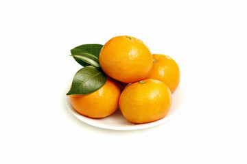 Ripe fresh tangerines and tangerine leaves
