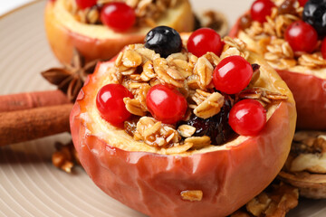 Concept of tasty food with baked apple, close up