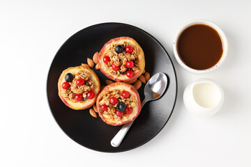 Concept of tasty food with baked apples on white background