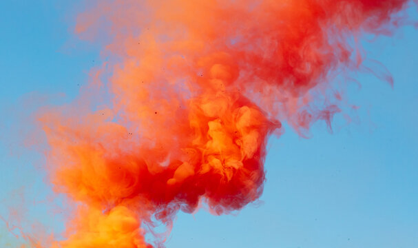 Red Smoke On A Blue Background.