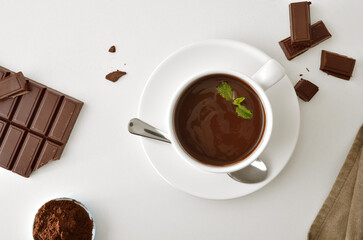Hot chocolate and confectionery chocolate on white table top