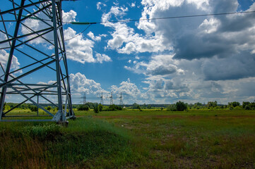 Silhouette of high voltage poles, power tower, electricity pylon, steel trellised tower, in the...