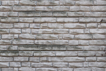 Concrete imitation of bricks on the fence. Texture