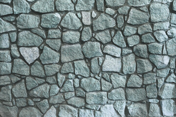 Fence masonry. Rubble stone. Texture