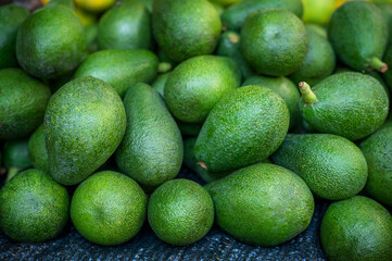 Selected ripe avocado boxes. boxes of avocado. Daylight. View from above. horizontal