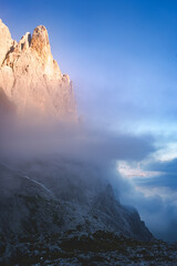 sunrise in the cloudy Cima Canali mountains of dolomites in pale di san martino