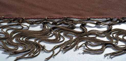 Background texture of silk fabric. This is a natural brown scarf, this beautiful nylon satin made...