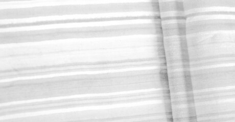 Fototapeta na wymiar Texture, background, pattern, white stripes, cotton fabric, Mapudungun pontro poncho, blanket, woolen fabric - these are outerwear designed to keep the body warm.