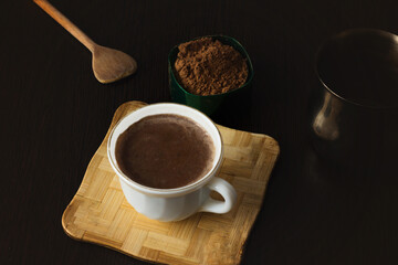 A cup of hot cocoa drink.