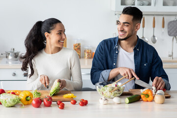 Young Arab Spouses Cooking Healthy Lunch Together In Kitchen At Home