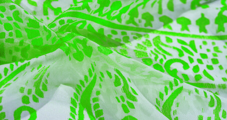 Texture, pattern, collection, silk fabric, female scarf, green emerald pastel on a beige background