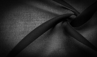 Background texture Dark black chiffon silk is a soft transparent fabric with a slight roughness...