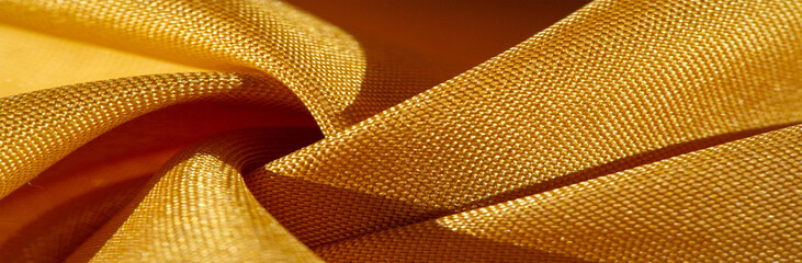 Texture, background, silk fabric, yellow amber. The photo is intended for, interior, imitation of a fashion designer, marketing, architecture, sketch, layout, surroundings - Powered by Adobe
