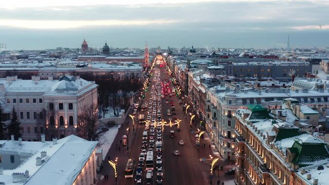 St. Petersburg, Russia, winter 2021: Aerial view winter city streets on new years eve, Snow covered buildings and illumination