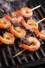 Freshly cooked shrimps on a grill