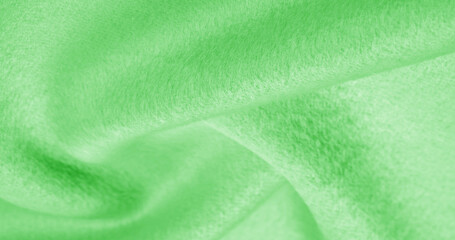 Texture, background, pattern. Cloth warm wool is green, Thick with heavy weight, this is an...