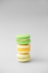 Macaroons on gray background. Multicolored French pastry macarons. Valentine's Day gift