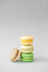 Macaroons on gray background. Multicolored French pastry macarons. Valentine's Day gift