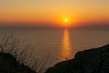 Beautiful sunset behind Kythera island. Natural beauty in an idyllic Greek island