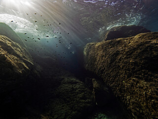 Rocks and surf underwater in the mediterranean sea