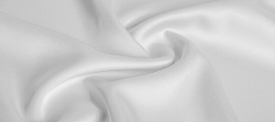 background texture, pattern. White silk fabric. It has a smooth matte finish and gets its strength from slightly twisted yarns. use this luxurious fabric for anything