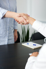 Close up of handshake in the office