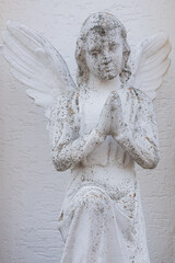 Vintage image of a sad angel on a bright background. detail