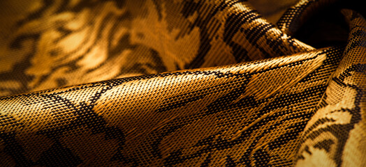 embossed pattern, composite textile, silk fabric of yellow, gold color, with a floral pattern, unusually pleasant visual sensations: slippery, coolness, softness; beautiful appearance, unique shine;