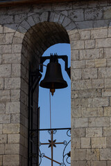 Large Church bell hanging outside. Close-up view of metal orthodox church bell