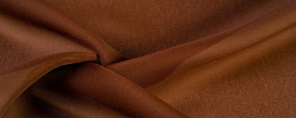 Silk brown fabric. Yard-side chocolate silk fabric, lightweight silky and comfortable creates a durable silky drape as well as versatility, making it suitable for a wide variety of design applications