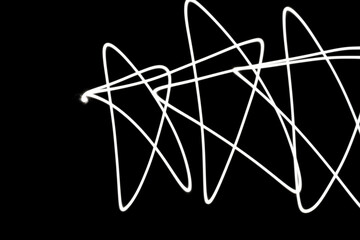 A star shape expressed in white light on a dark night.