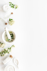 White organic cosmetics products with white flowers