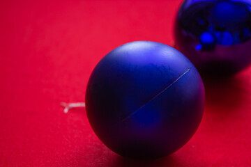 Silver and blue christmas ornaments on dark blue background with space for text. Merry christmas card. Winter holidays. Xmas theme.