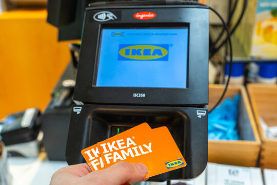 Ikea store lot in Alfafar, Valencia. Credit card payment terminal (POS Machine) with Ikea name on the screen. Contactless payment.  Ikea family cards.