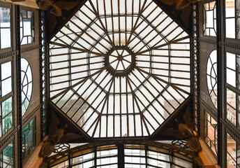 View from below of the glazed dome of Galleria Giuseppe Mazzini (1880), a covered shopping gallery located in the center of Genoa, Liguria, Italy