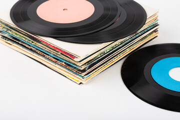 A stack of vinyl records on a white background.