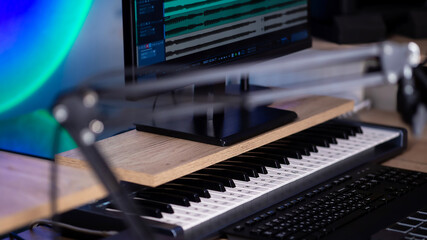 Modern synthesizer MIDI keyboard in Home Music studio.