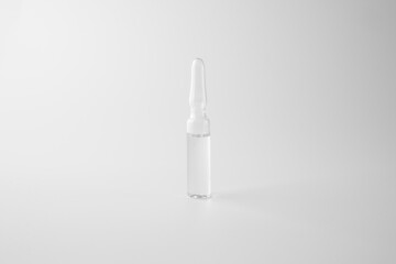 Transparent ampoule. Glass capsule container liquid injection, isolated. Concentrate skincare or haircare product in ampule