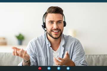 Video conference. Happy man in headset making web call and gesturing to camera, pov screenshot of positive guy