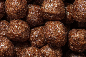 Corn balls in chocolate glaze close-up.