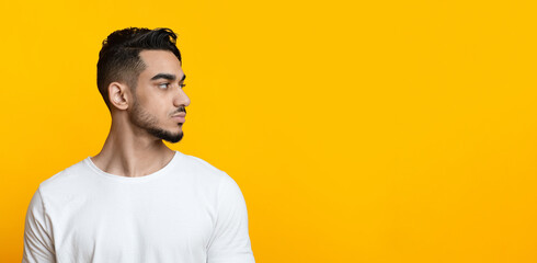 Serious middle-eastern man looking at copy space, profile portrait