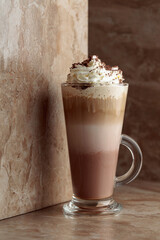 Milk coffee cocktail with whipped cream.