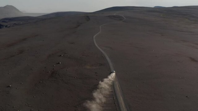 High Angle View Off Road Car Driving Motorway Isolated Desert Rock Highlands In Iceland. Aerial View Icelandic Landscape Of Amazing Countryside With Vehicle Driving Highway. Freedom And Exploration