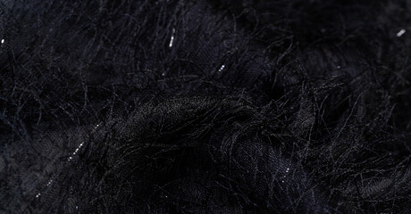 Charcoal black silk fabric with sequins and yarns over the surface of the fabric. This ombre tulle in black with abstract embroidery, embellished with sequins and yarns from a European designer